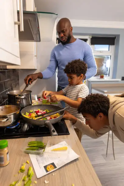 a contemporary family cooking together