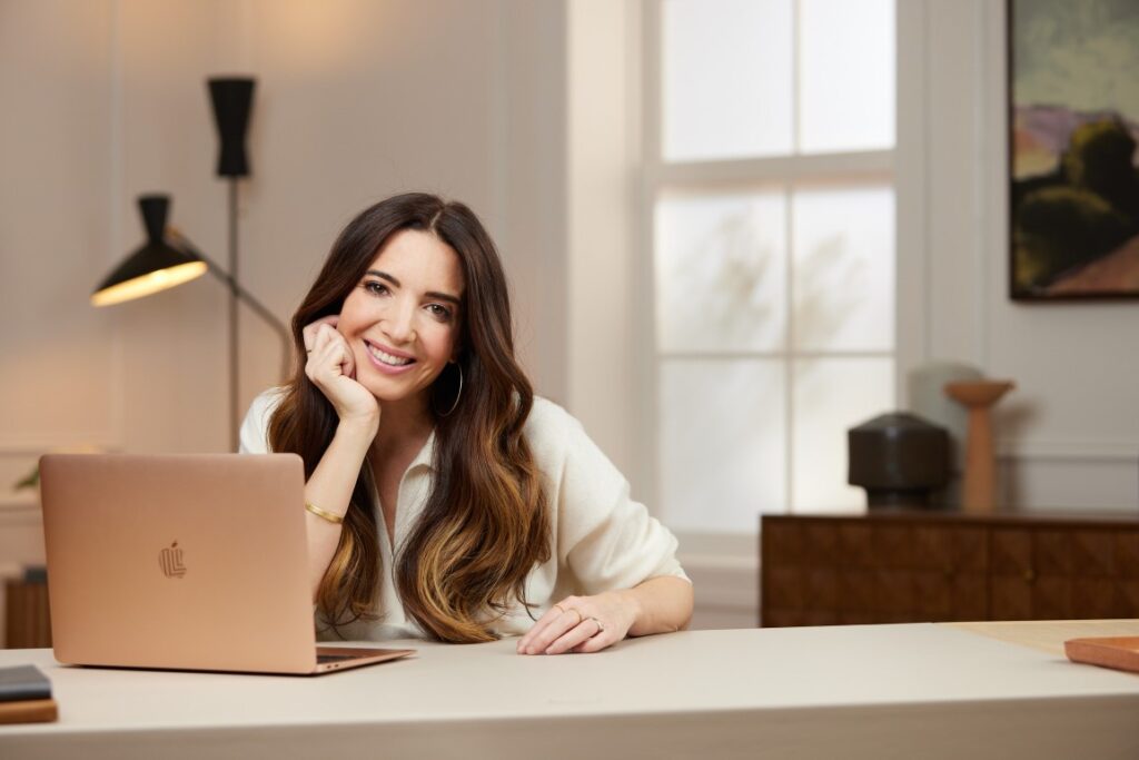 Marie Forleo B School pictures at desk in new york apartment
