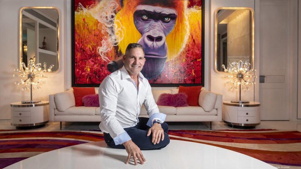 Grant in living room in front of big colorful picture of a gorilla