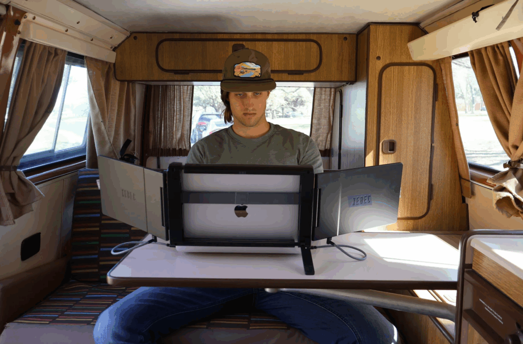 man working from home in his rv