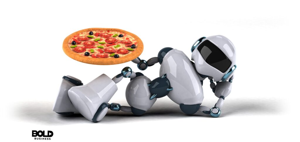 a robot holding a pizza